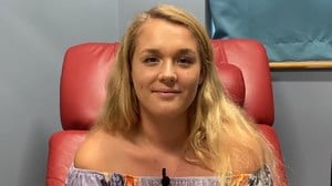 Screenshot of a female patient from a video review
